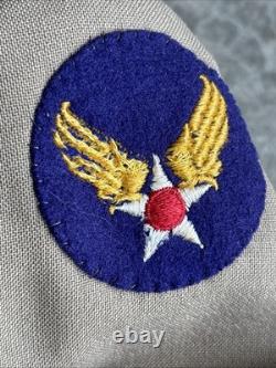 Vintage WWII U. S. Army Air Forces Uniform Jacket with Pins Patches Dog Tags Photo