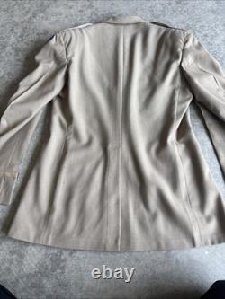 Vintage WWII U. S. Army Air Forces Uniform Jacket with Pins Patches Dog Tags Photo